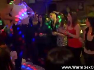 Lascivious young lady sucks a lad on the dancefloor
